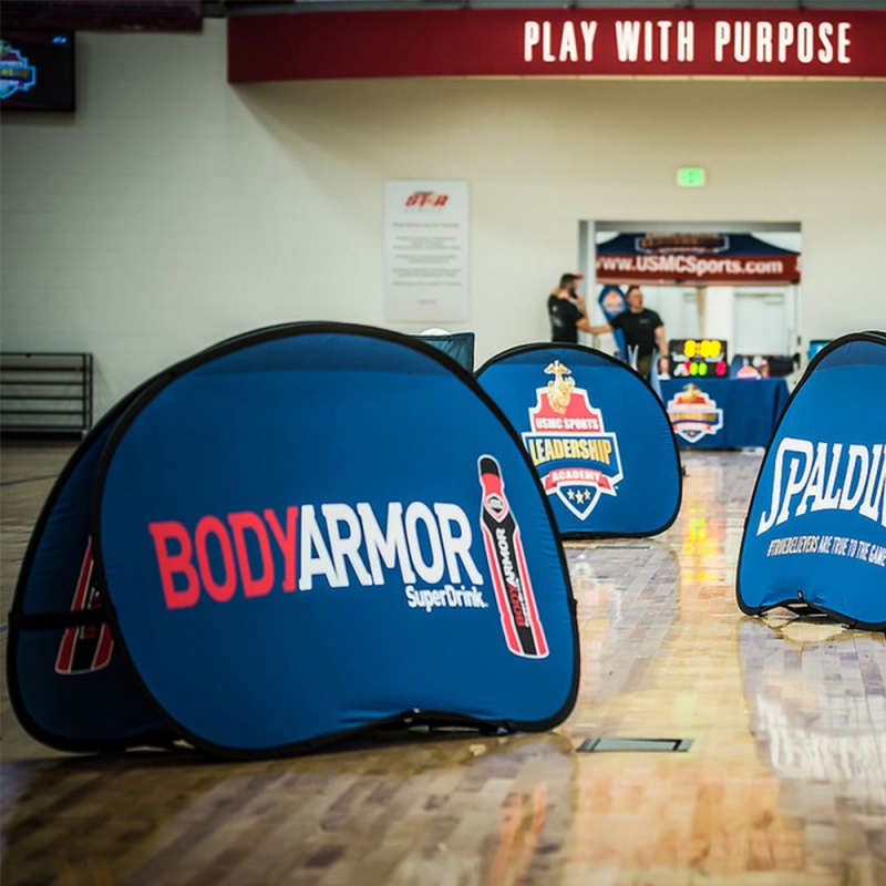 Custom pop out advertising banners at an outdoor event