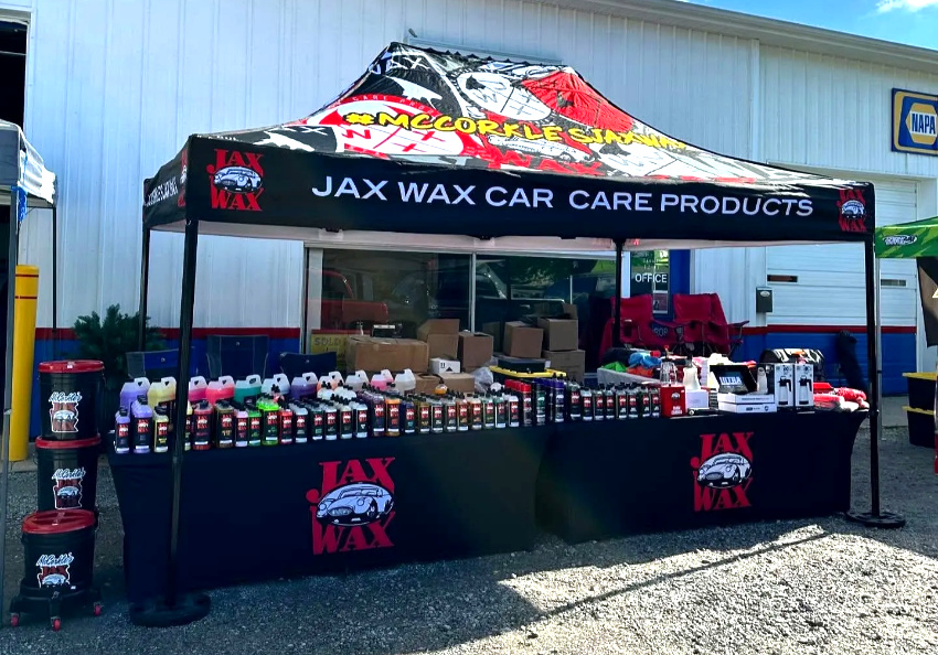 JAX WAX custom printed canopy featuring full‑color sublimation graphics at an outdoor setup