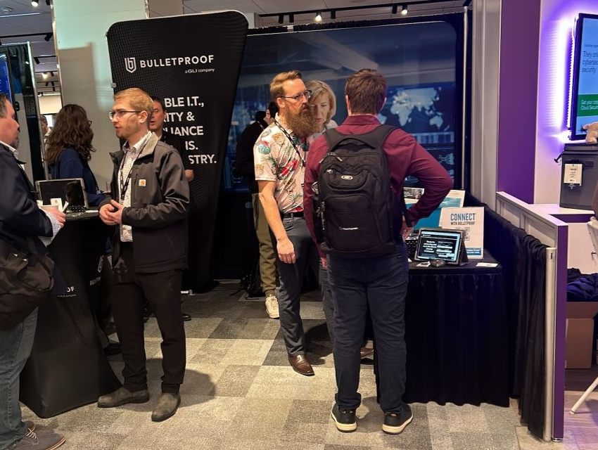Portable exhibition stand with InstaStretch tension fabric displays used by Bulletproof at a busy trade show