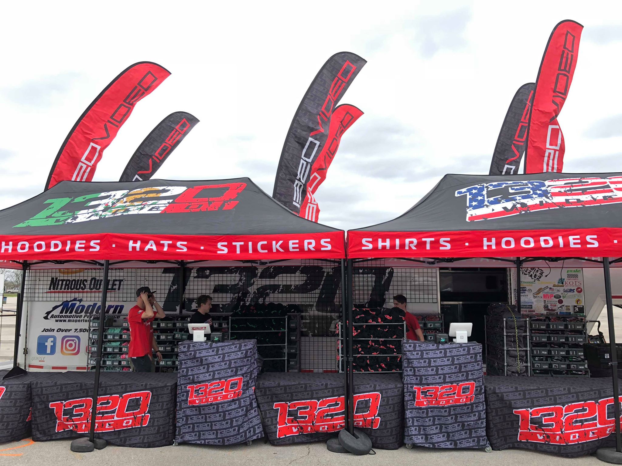 Custom branded tents and flags at an outdoor event