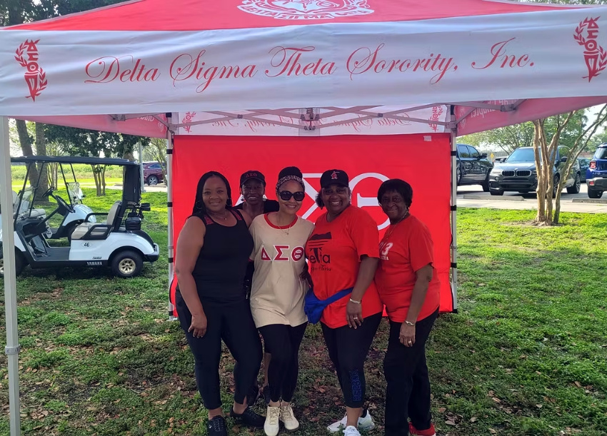 Custom red Delta Sigma Theta tent setup for Glades Alumnae Chapter