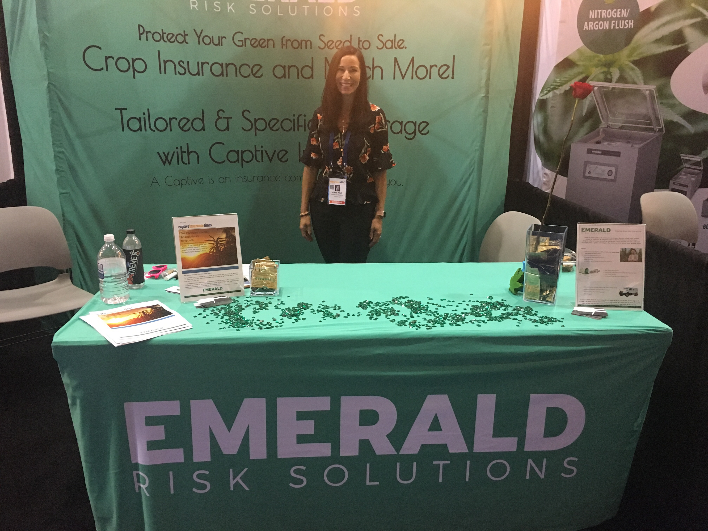 Fitted trade show table cover for Emerald Risk Solutions booth