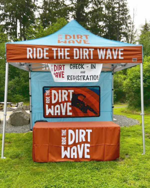 Ride the Dirt Wave custom pop up tent Impact Pro Package with check-in and registration signage at Oregon coastal mountain biking event