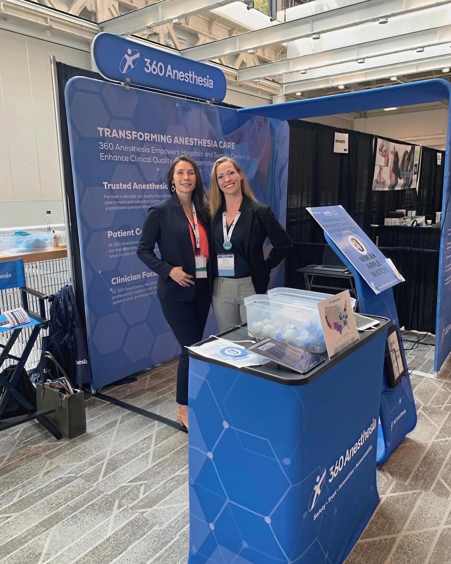 Side angle of 360 Anesthesia booth showing brochure stand and messaging panel