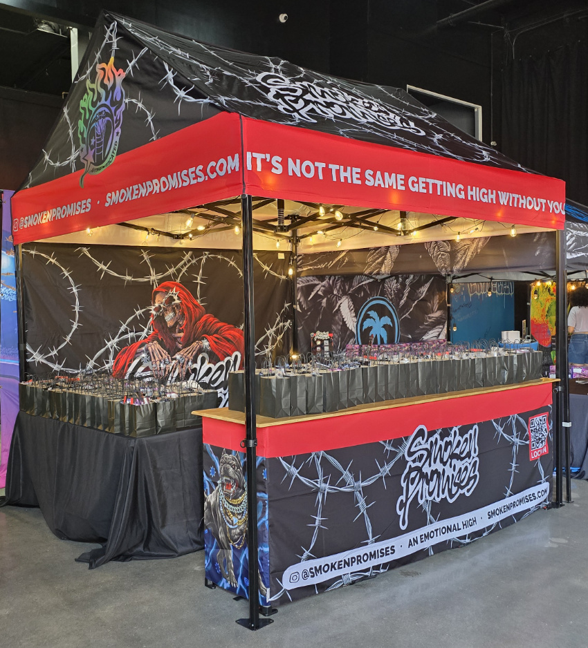 Front view of Smoken Promises custom Cabin canopy with bold valance text and printed back wall