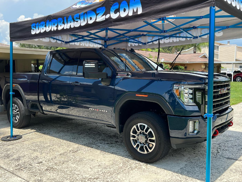 Truck parked under the Suburbia Sudz Pro Expo tent during a live detailing demo