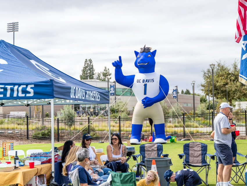 UC Davis Athletics inflatable mascot set up near event tent for campus celebrations and sports events
