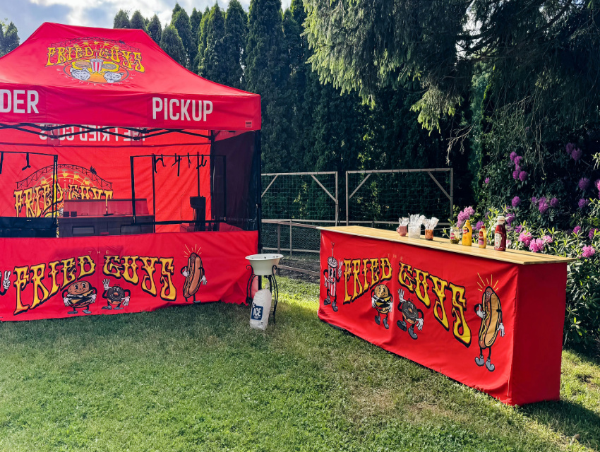 Vendor Pro aluminum counter set up outside the tent as a standalone station for condiments and extra essentials